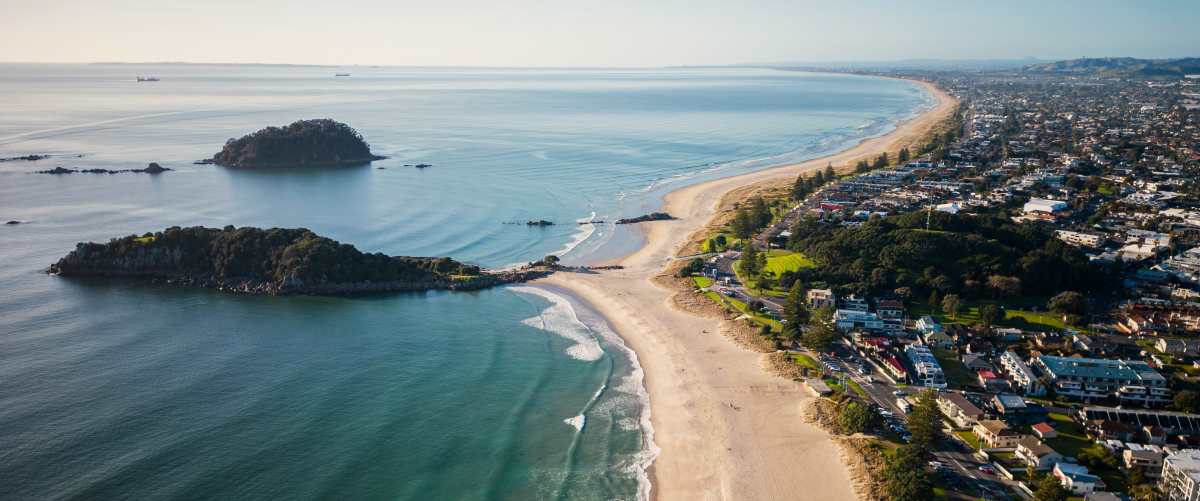 aerial-view-of-mount-maunganui-with-bay-of-plenty and Tauranga New Zealand zip code 3110 Mount Maunganui with Bay of Plenty and modern buildings, Tauranga, New Zealand zip code 3110